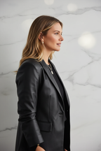 Black leather blazer side profile marble background