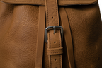 Macro close-up of Zunera leather backpack buckle stitching and hardware