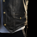 Men's distressed black leather snap vest – pocket and hem close-up