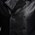 Black leather blazer button and texture close-up