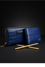 3/4 angle - both wallets upright with crossed gold pens
