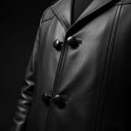 Black leather long coat macro close-up texture and button detail
