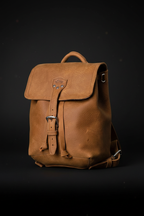 Zunera vintage leather backpack cinematic studio shot on matte black