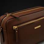 Close-up of leather texture and gold hardware