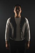 Men's distressed black leather snap vest – front pose