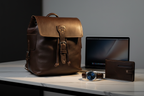 Zunera leather backpack on marble desk with luxury watch and MacBook